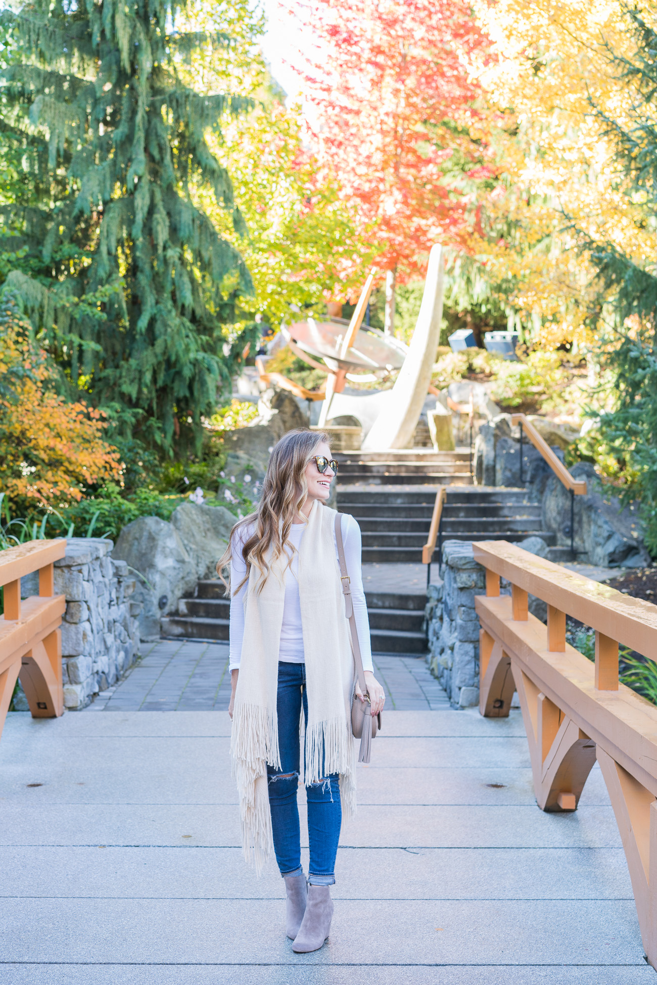 Nordstrom Fall outfit fringe sweater vest white thermal tee distressed ag skinny jeans dolce vita tan booties angela lanter hello gorgeous